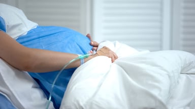 pregnant women in hospital bed
